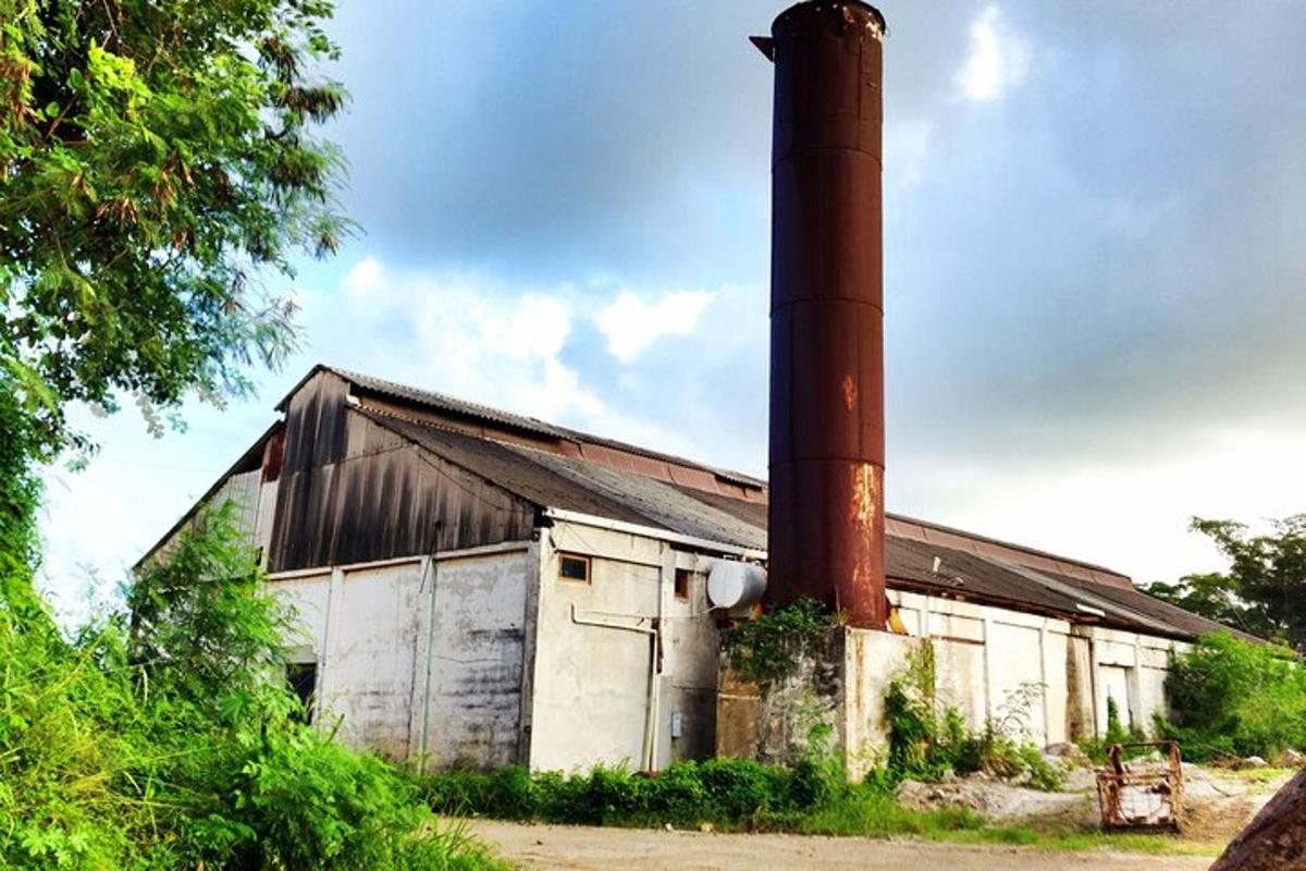 an old building with a large smoke stack