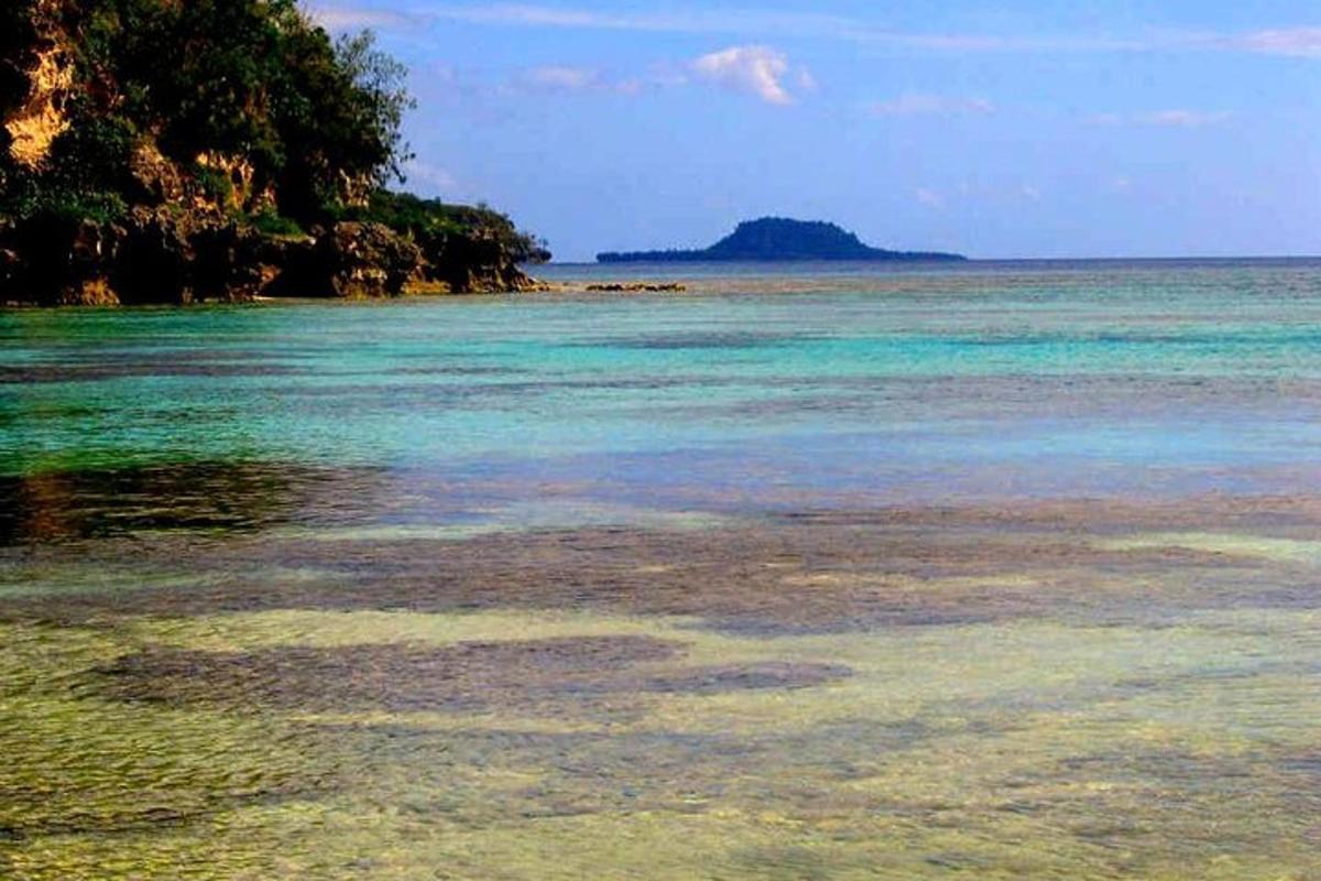 a view of a beach with the water
