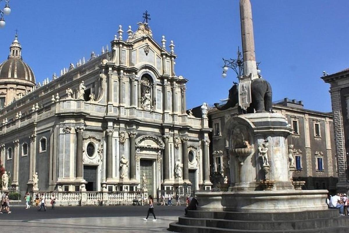 a large building with a statue in front of it