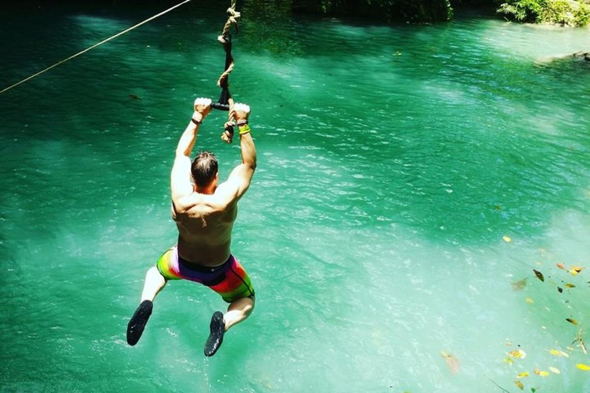 a man in the water with a rope in the water