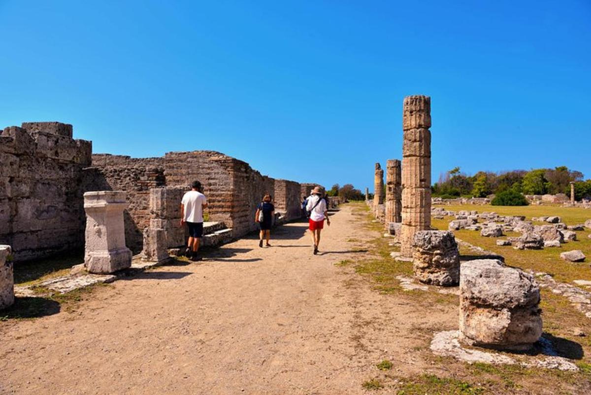 a group of people walking through the ruins