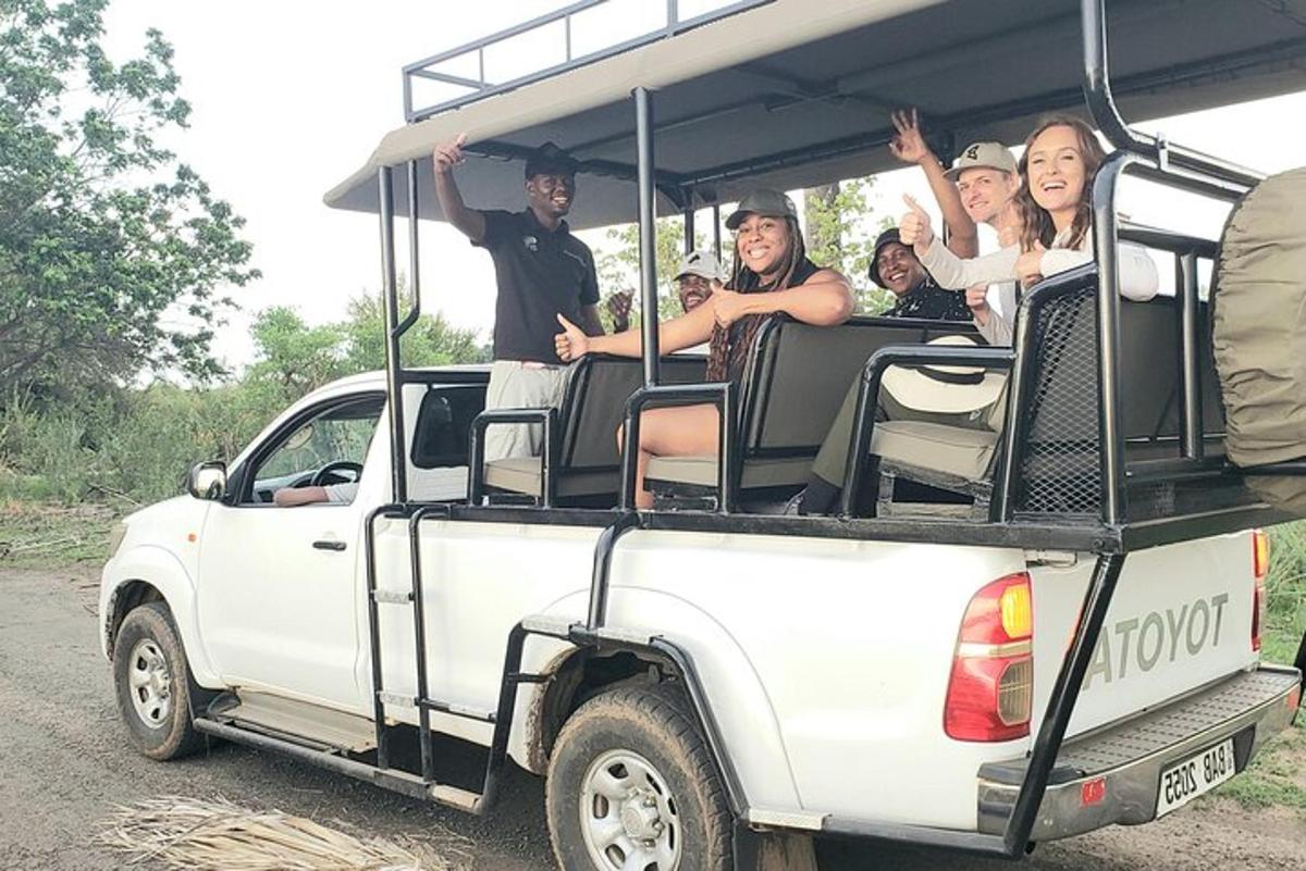 a group of people riding in the back of a truck