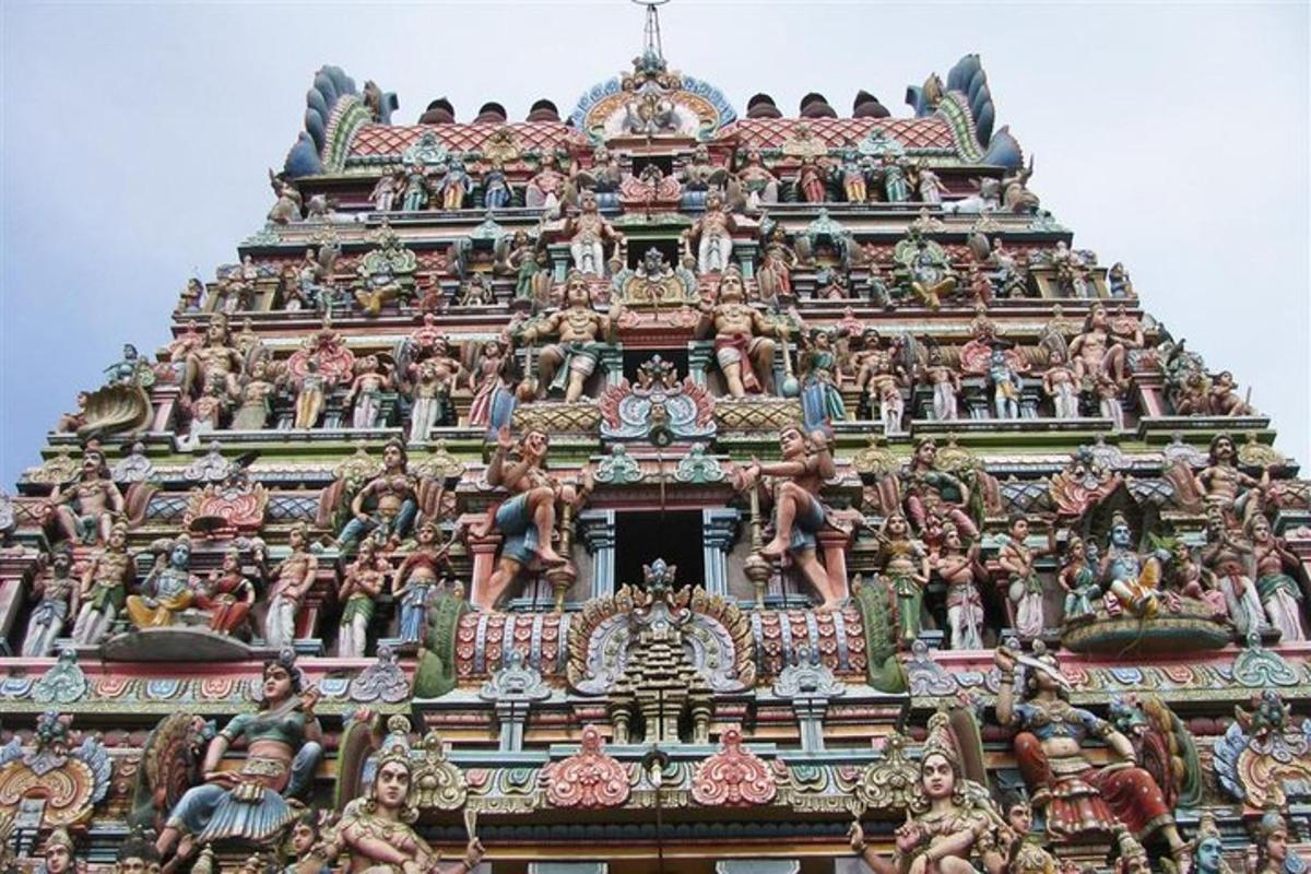 a tower of a temple with many statues on it