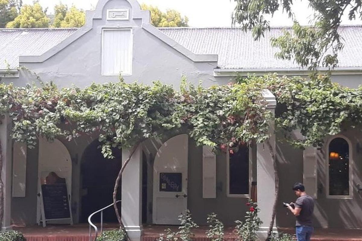 a man standing in front of a house
