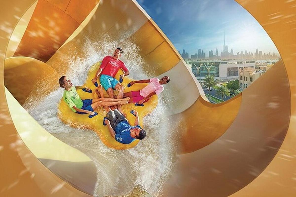 a group of people riding a wave ride at a roller coaster