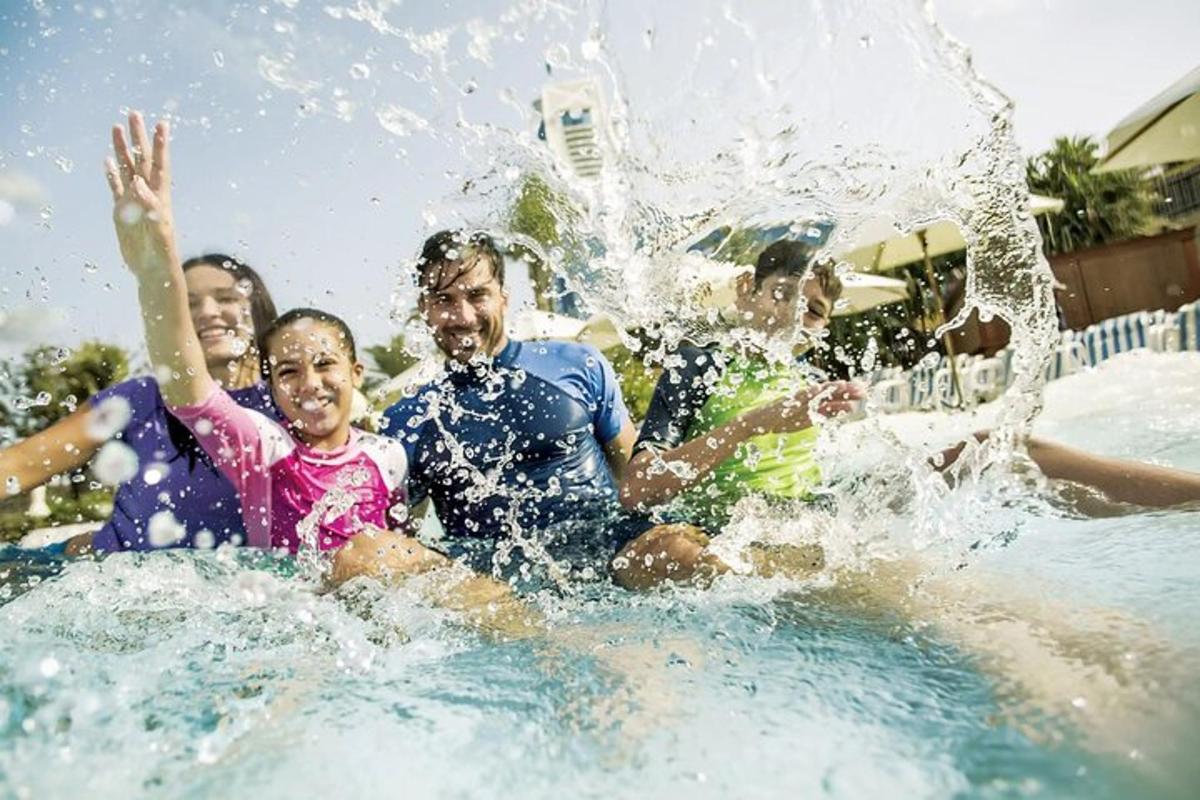 a group of people playing in a water park