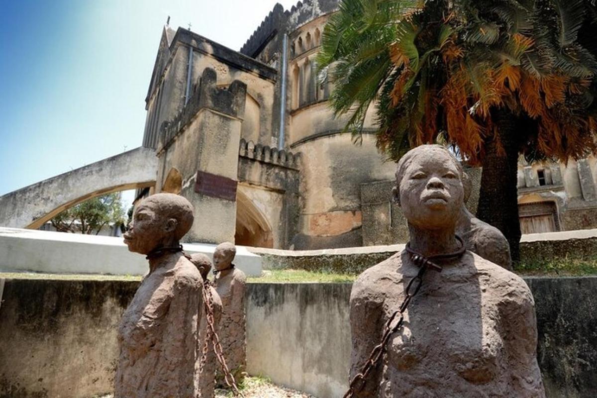 two statues of men standing in front of a building