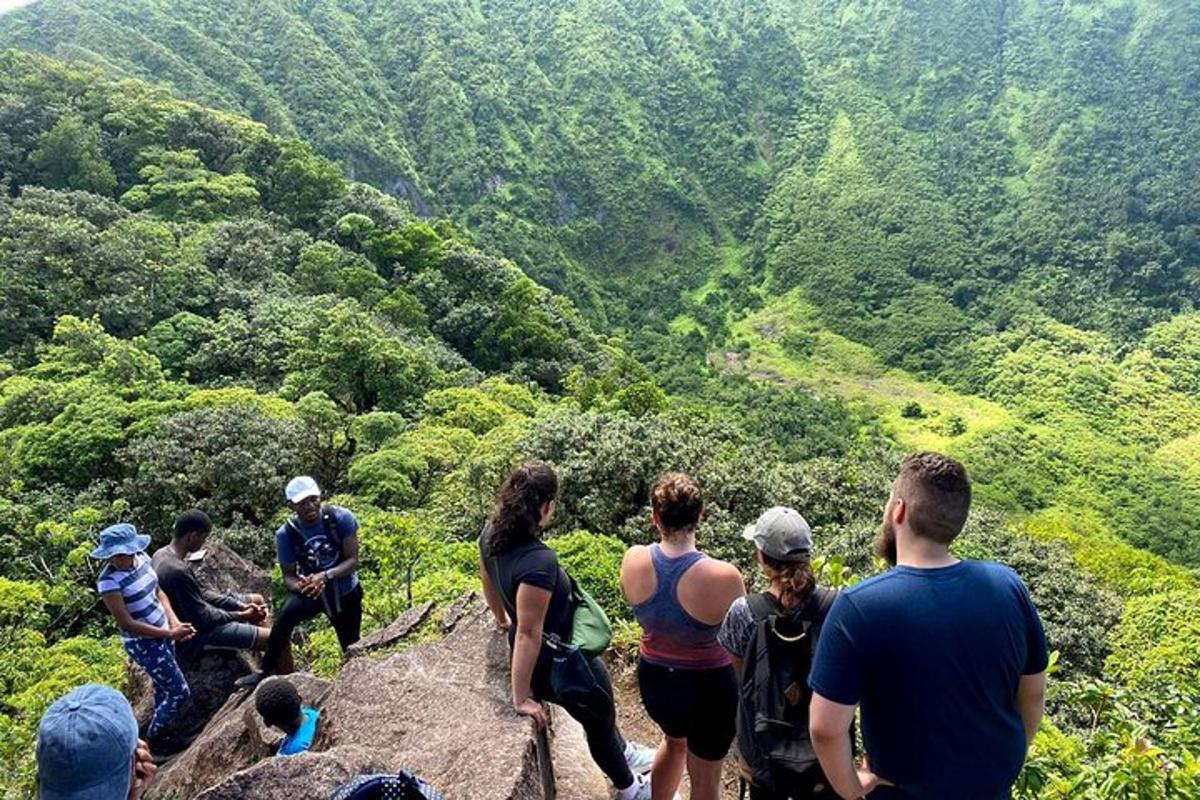 a group of people standing on top of a mountain