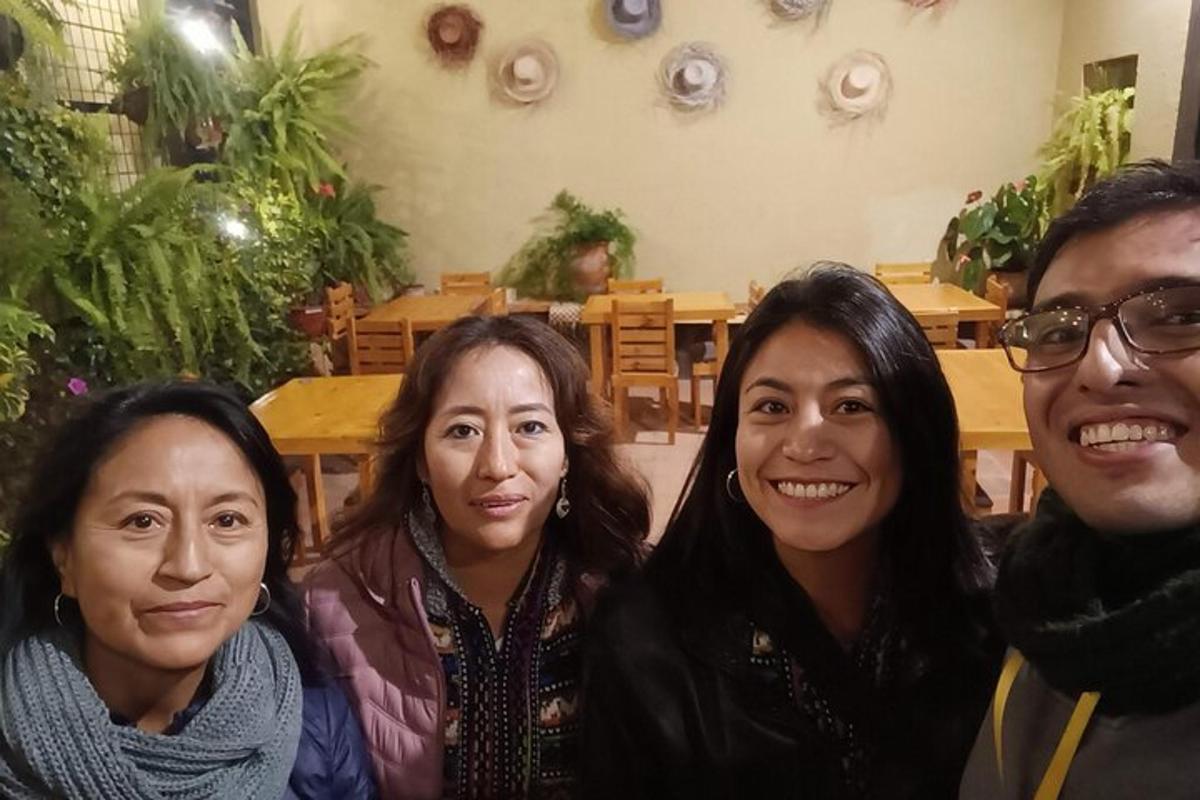 a group of four people posing for a picture