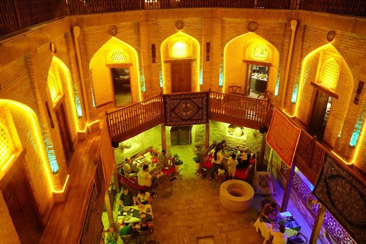 an overhead view of a building with people sitting at tables