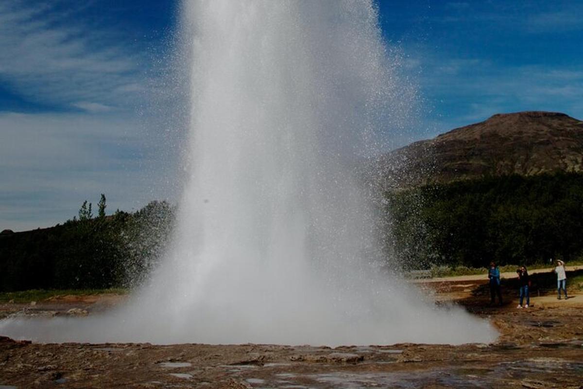 a largeume of water is shooting up into the air