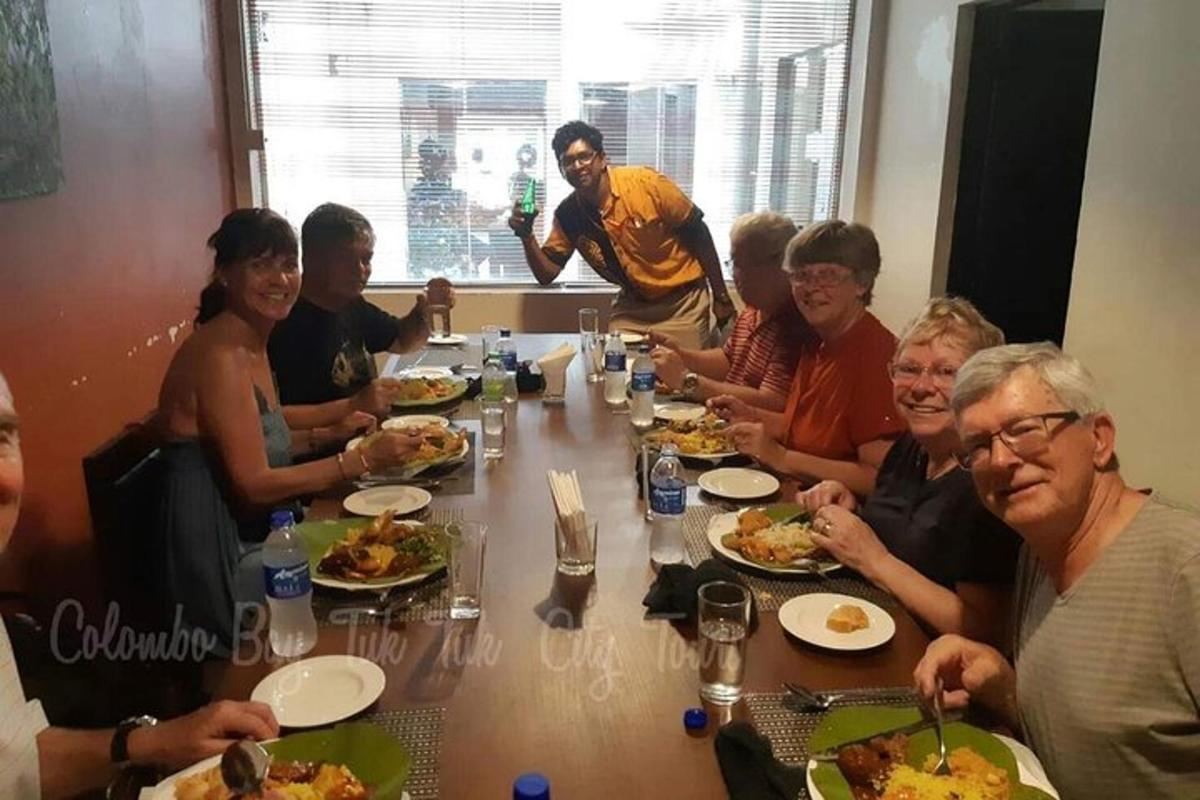 a group of people sitting around a table eating food
