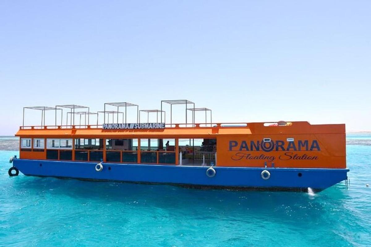 an orange and blue boat in the water