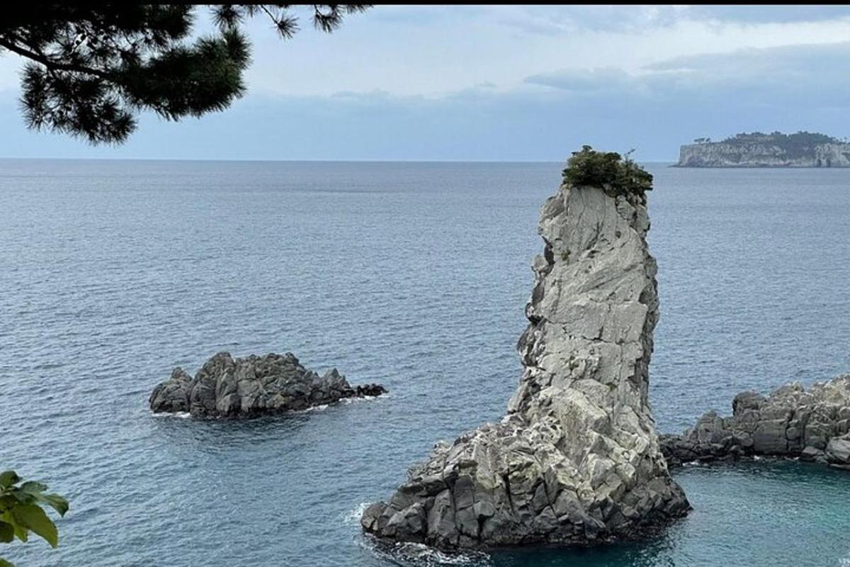 a rock formation in the middle of the ocean