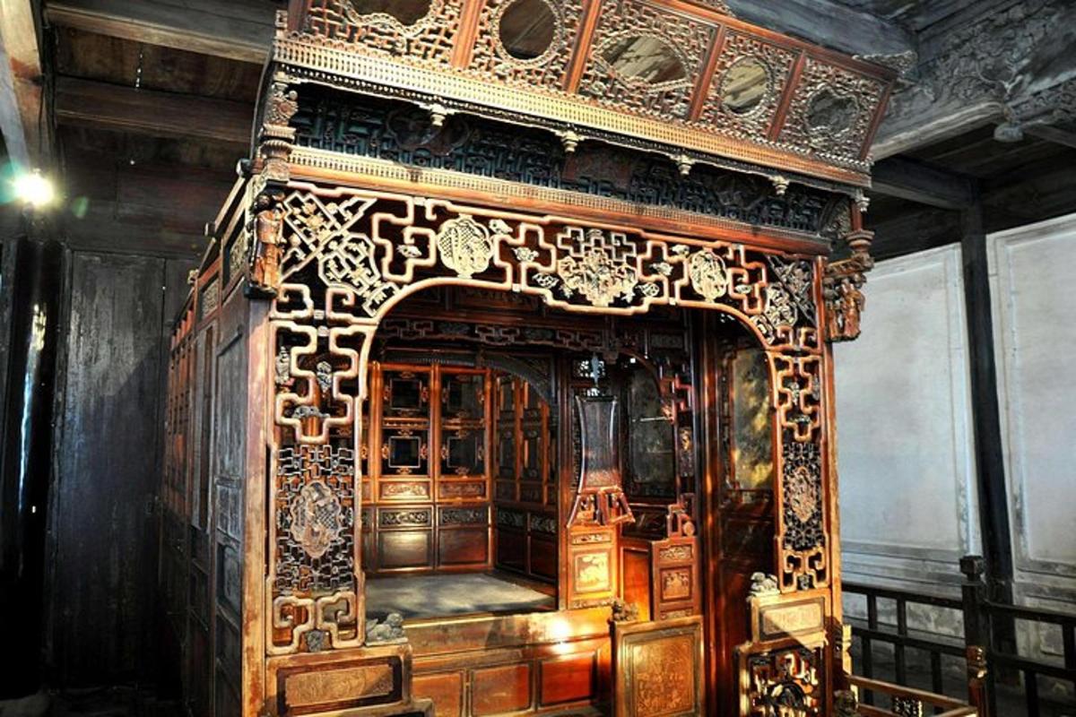 an ornate wooden fireplace in a room