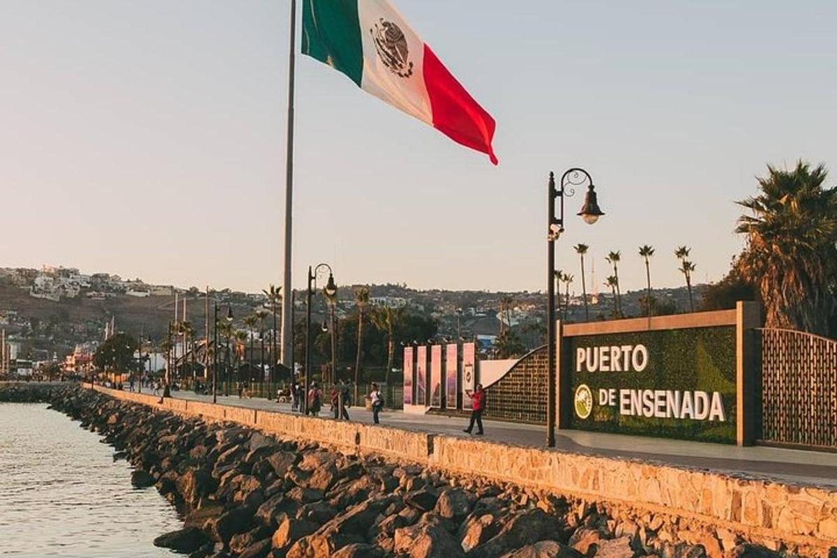 a flag flying next to a body of water
