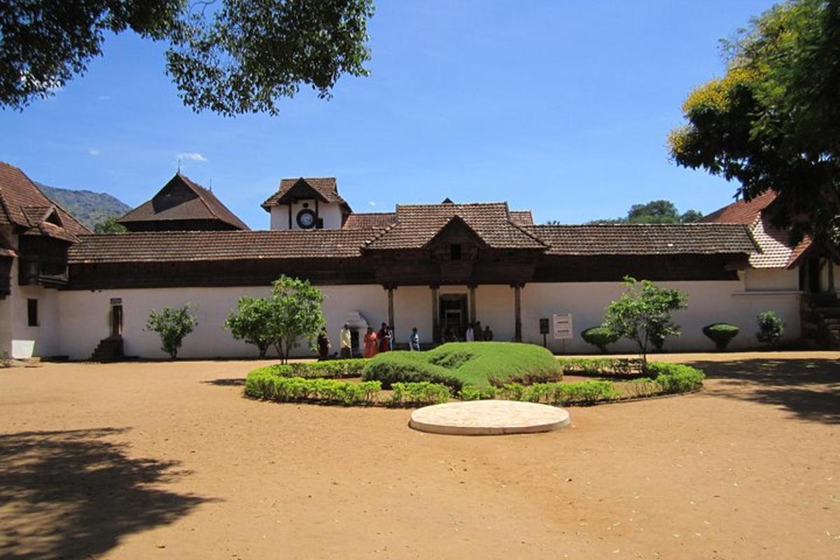 a large building with a garden in front of it