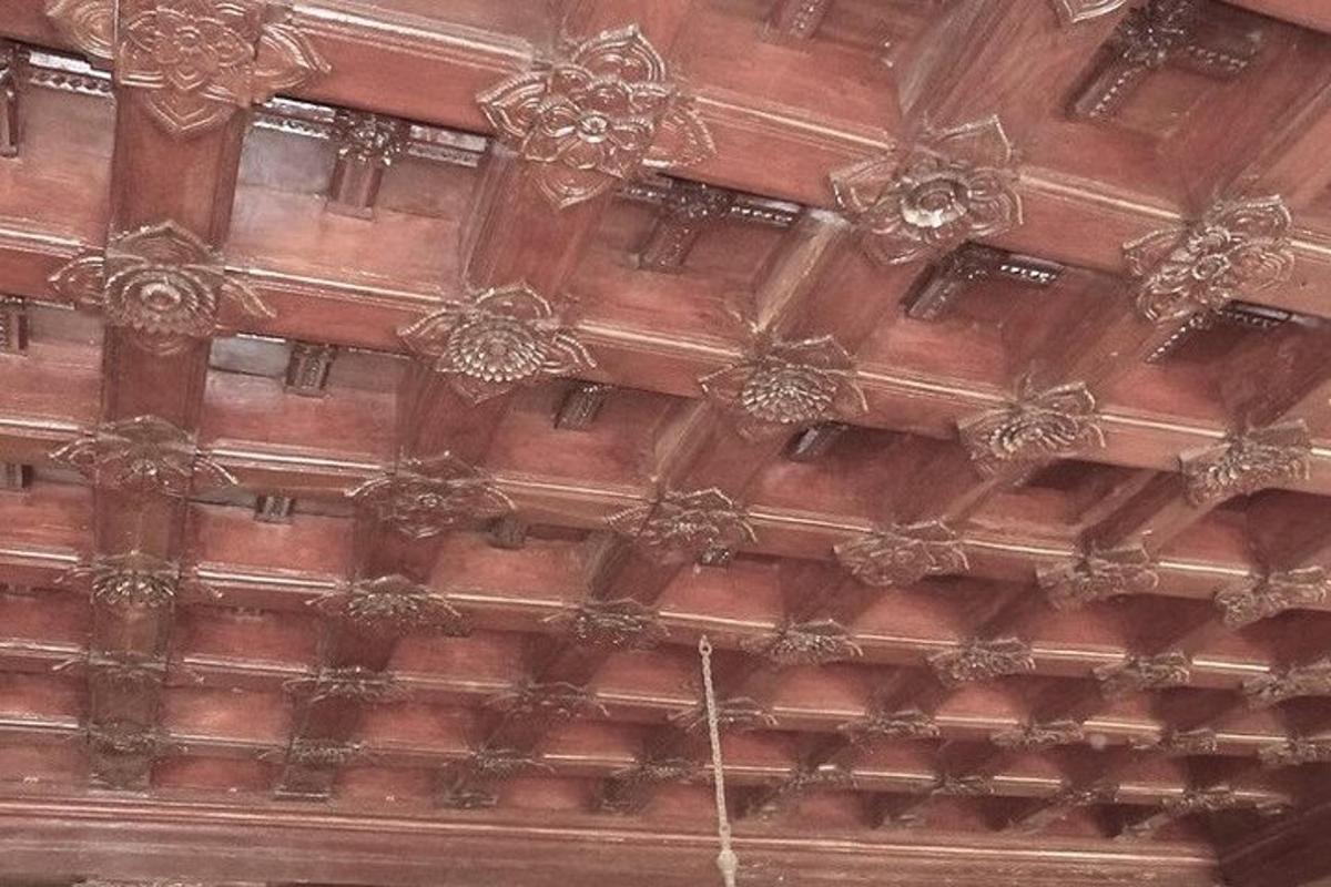 a wooden ceiling of a building with a rope