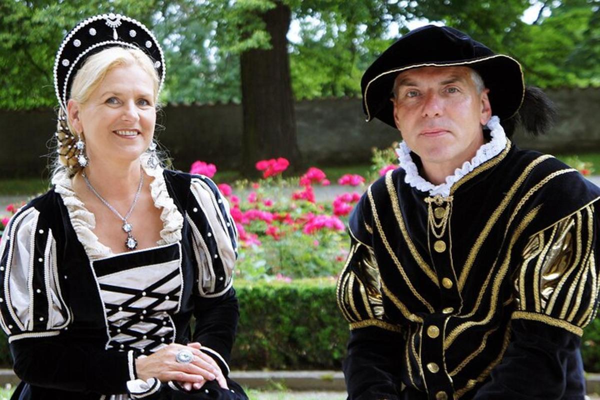 a man and a woman dressed in historical clothing