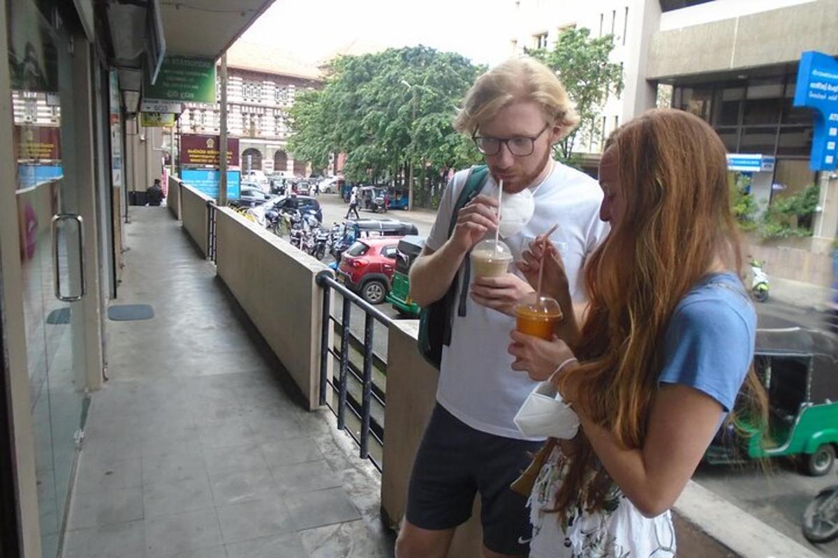 a man and a woman looking at their cell phone