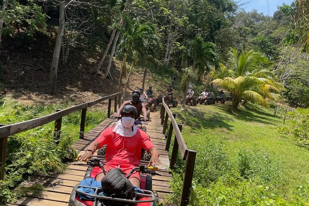 a group of people riding motorcycles down a wooden trail