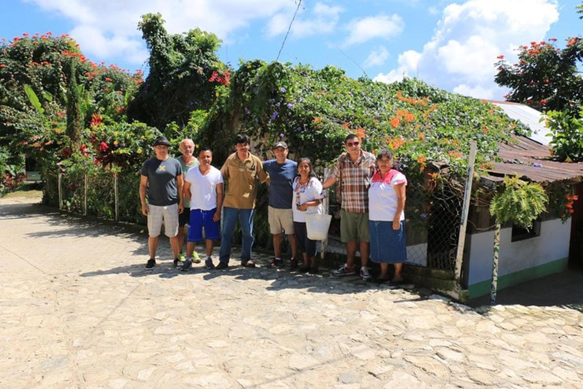 a group of people standing in front of a house