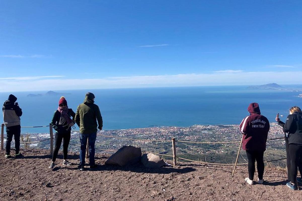 a group of people standing on top of a mountain