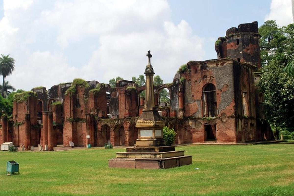an old building with a statue in front of it