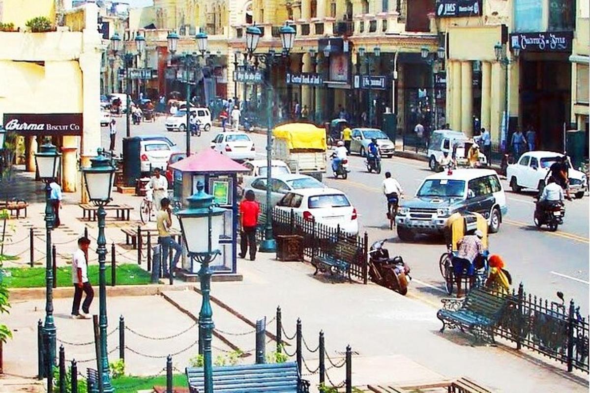 a busy city street with cars and people on the street