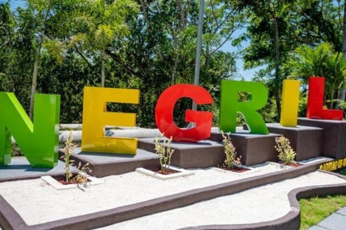 a large sign that says new park in a park