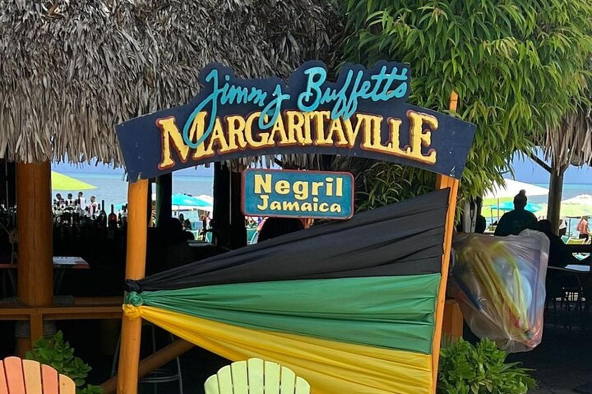 a sign for a restaurant on the beach