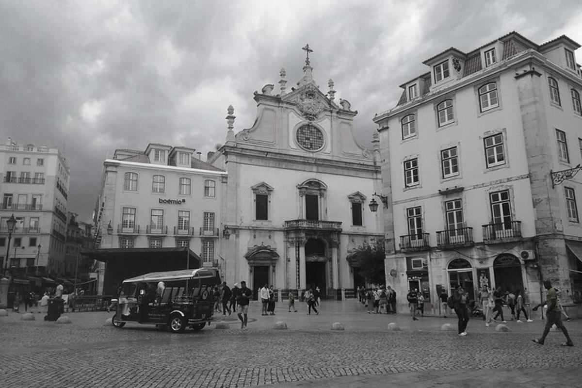 a black and white photo of a building with a clock tower