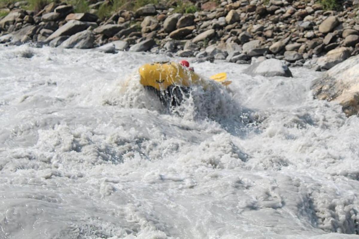 a yellow fire hydrant in the middle of a river
