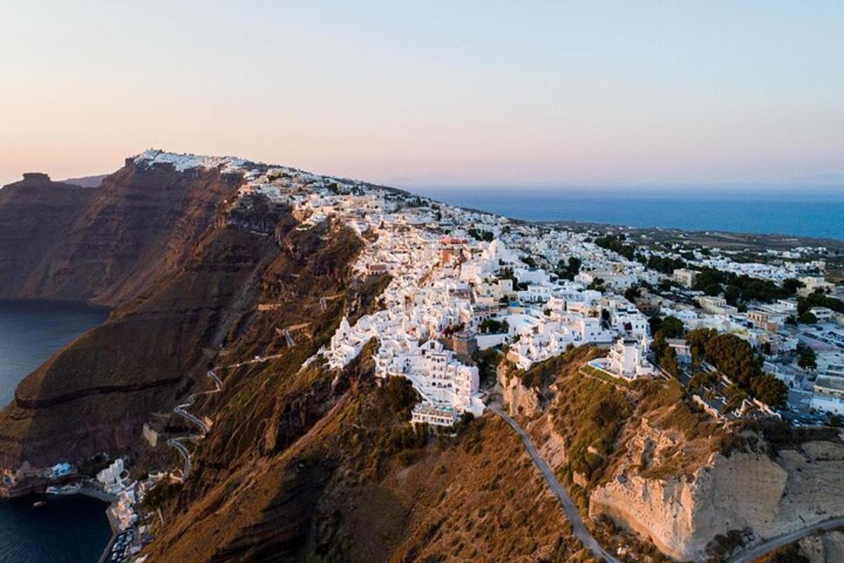 an aerial view of a village on the side of a mountain