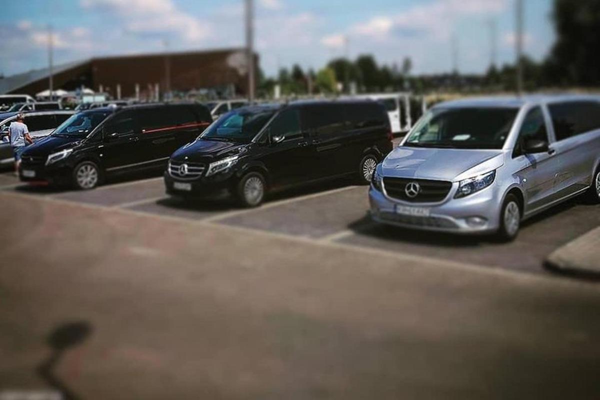 a row of parked cars in a parking lot