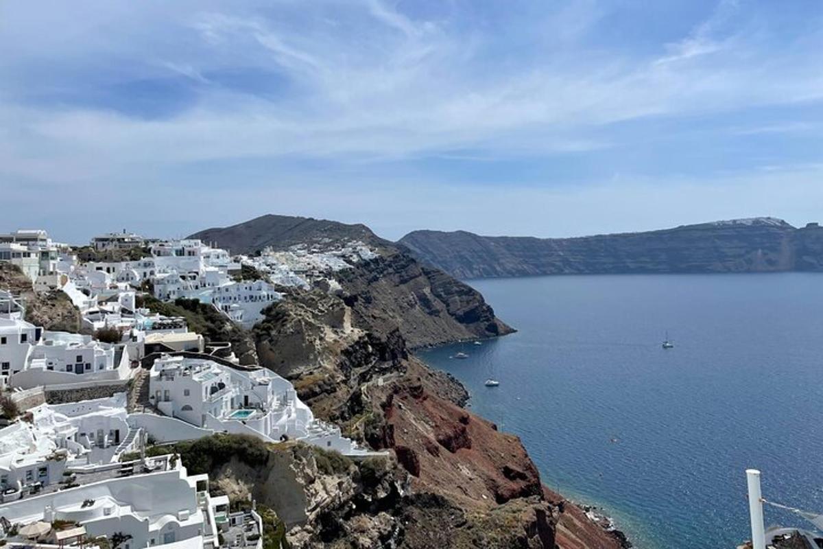 a group of white buildings on the side of a mountain