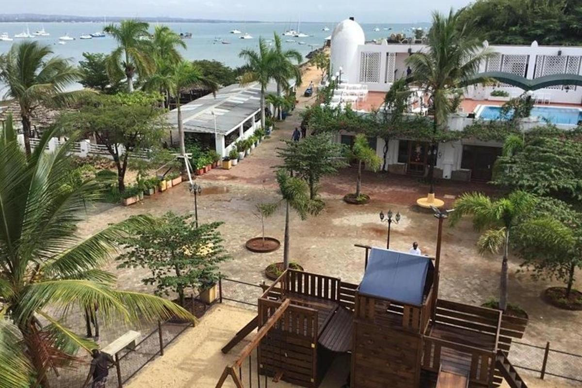 a view from the balcony of a resort with benches