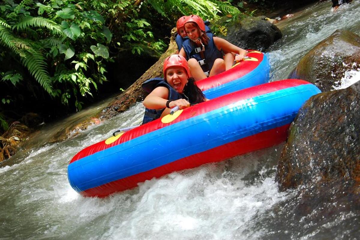 two people riding in a raft in a river