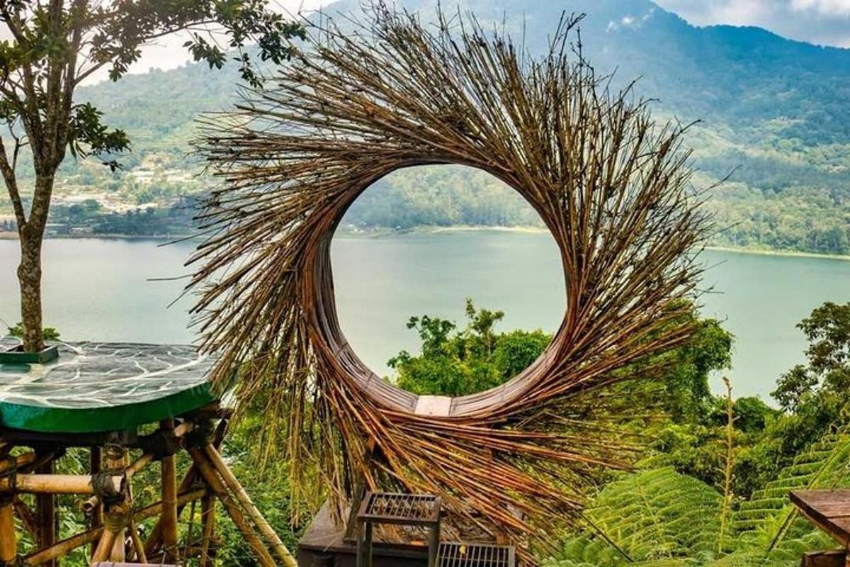 a circular sculpture with a view of a body of water