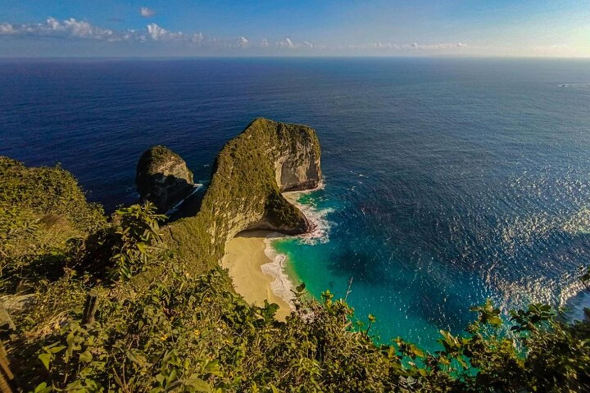an aerial view of a rocky island in the ocean