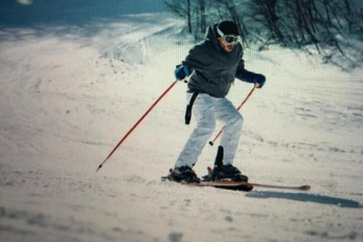 a person is skiing down a snow covered slope