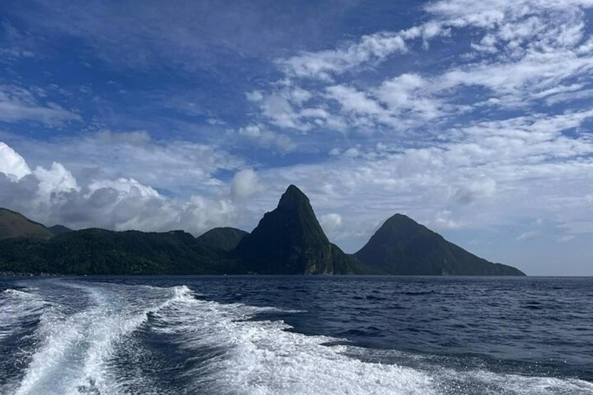 a boat in the water with mountains in the background
