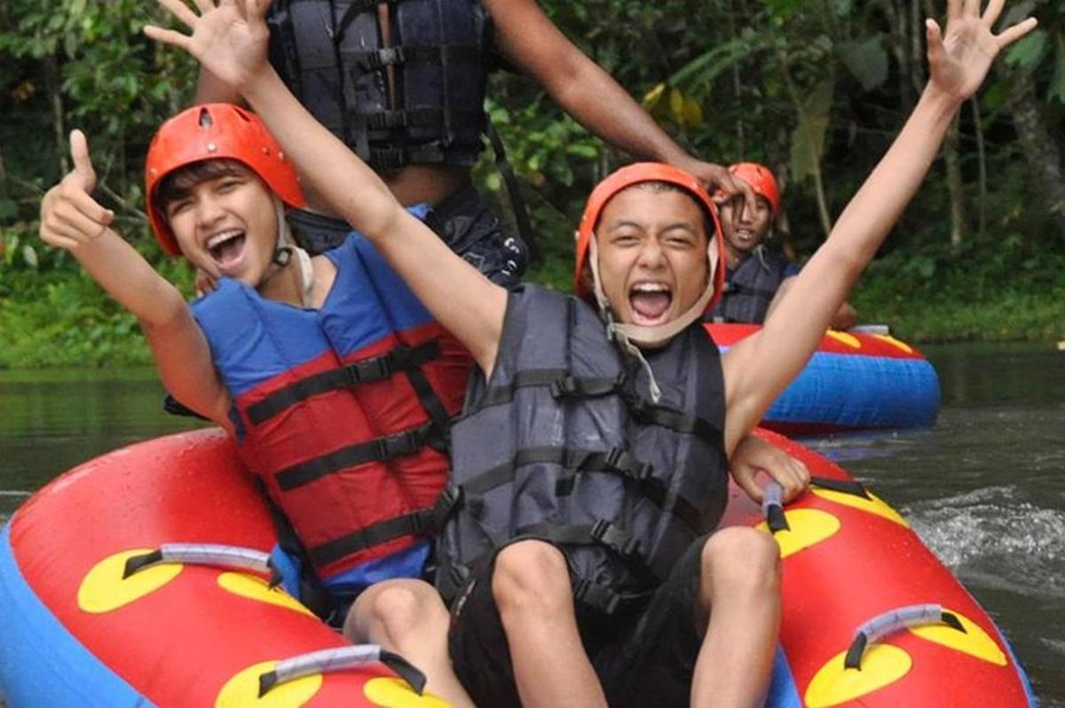 a group of people rafting down a river