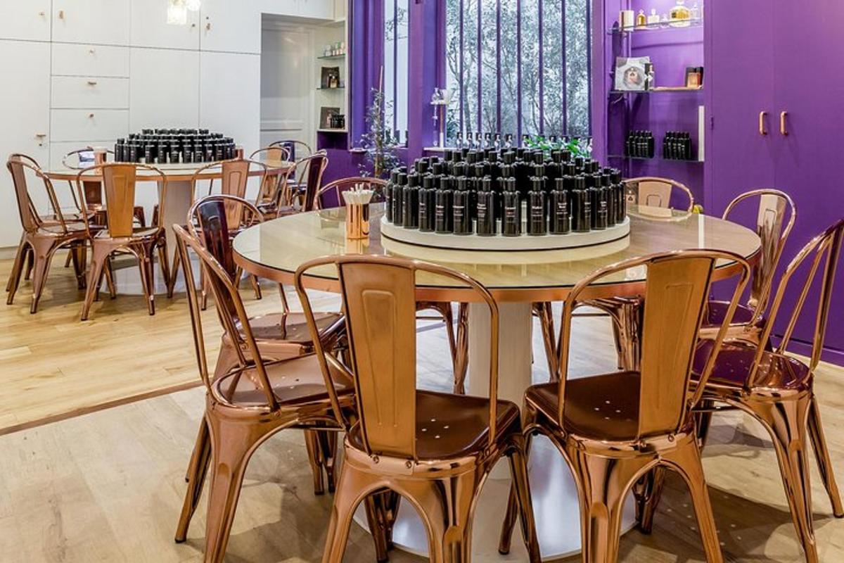 a table and chairs with wine bottles on it