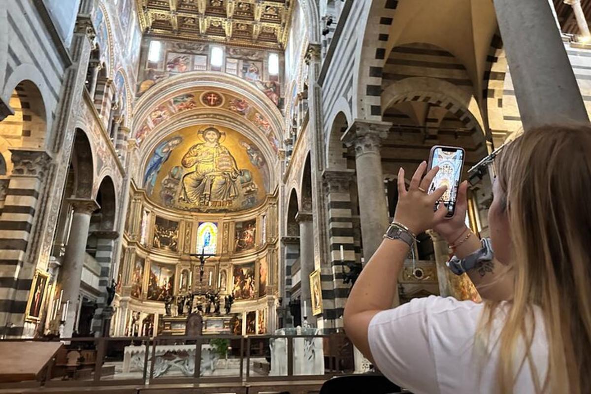 a woman taking a picture of a church
