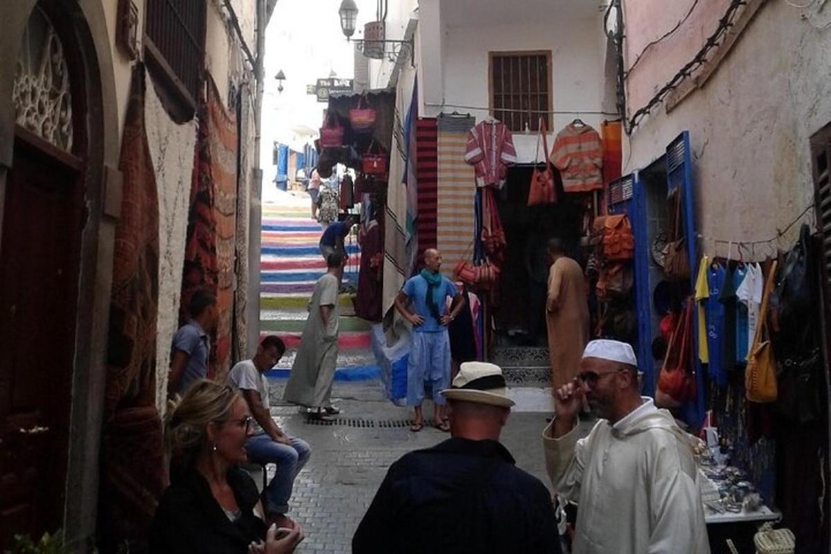 a group of people walking through an alley