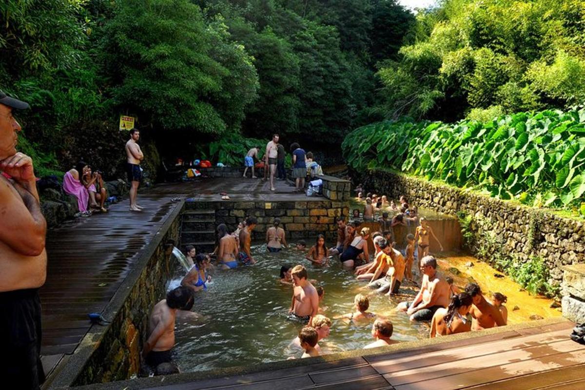 a group of people sitting in the water