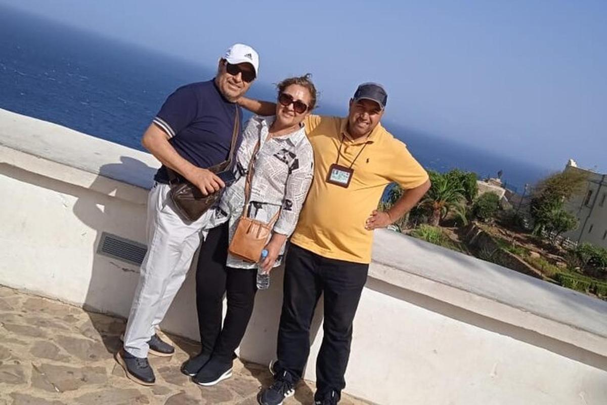 a group of three people posing for a picture