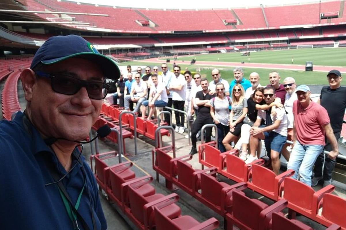 a man standing in front of a group of people at a stadium