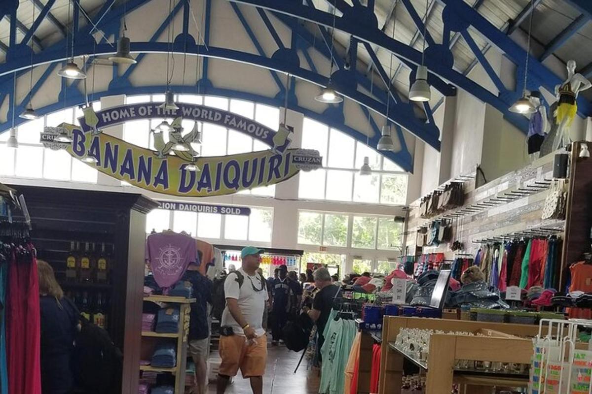 a group of people walking through a store with a sign